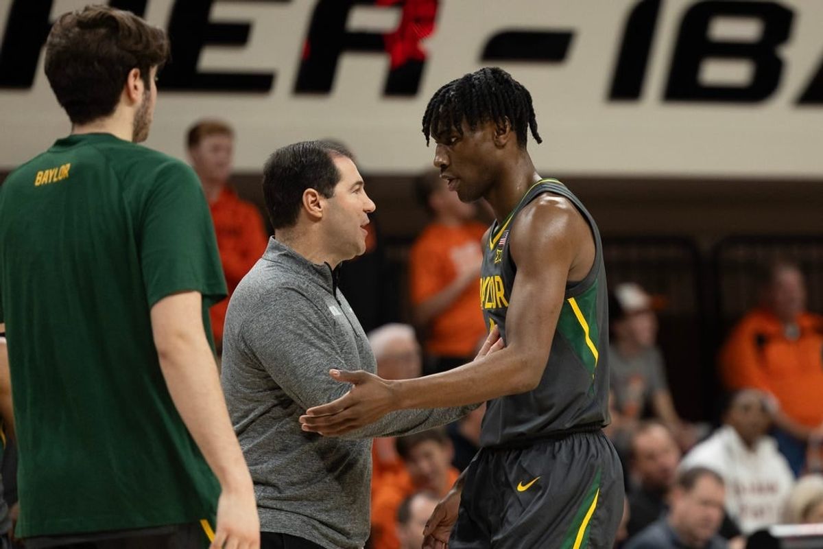 Jan 6, 2024; Stillwater, Okla, USA; Baylor Bears head coach Scott Drew talks with guard Ja'Kobe Walter (4) in the first half of an NCAA men  s basketball game against the Oklahoma State Cowboys at Gallagher-Iba arena.