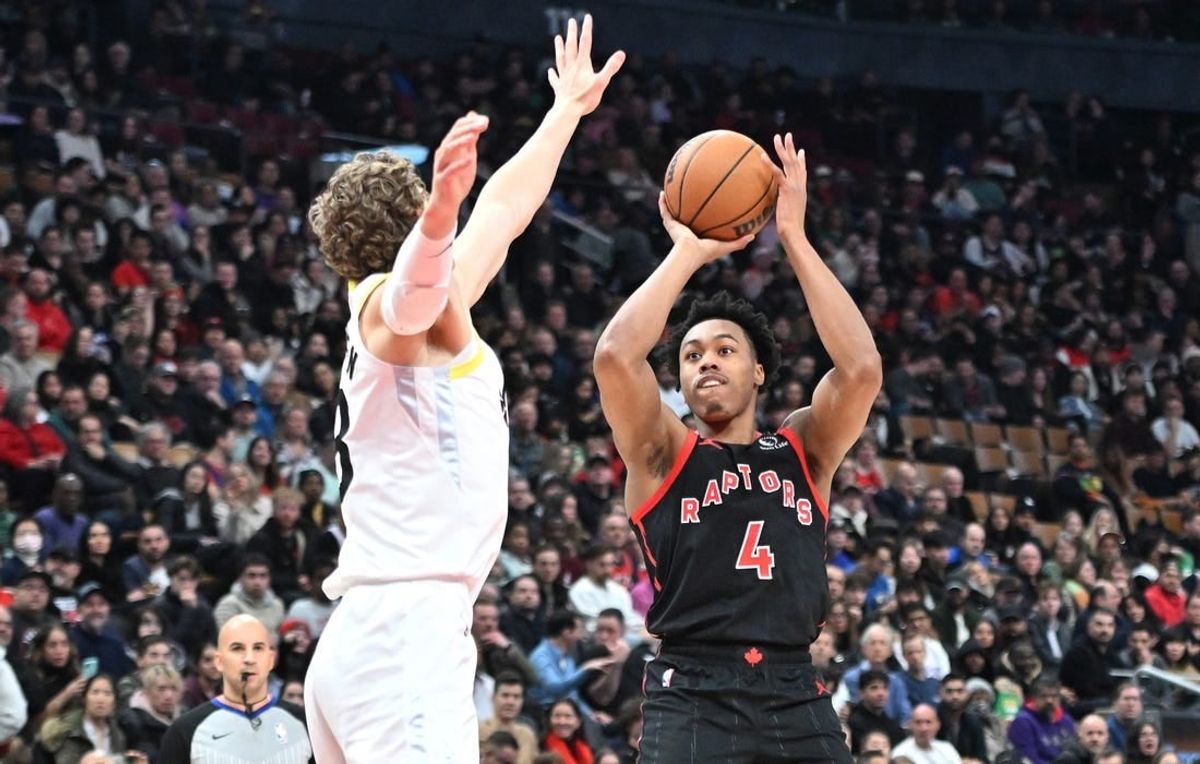 Dec 23, 2023; Toronto, Ontario, CAN;  Toronto Raptors forward Scottie Barnes (4) shoots the ball as Utah Jazz forward Lauri Markkanen (23) defends in the first half at Scotiabank Arena.