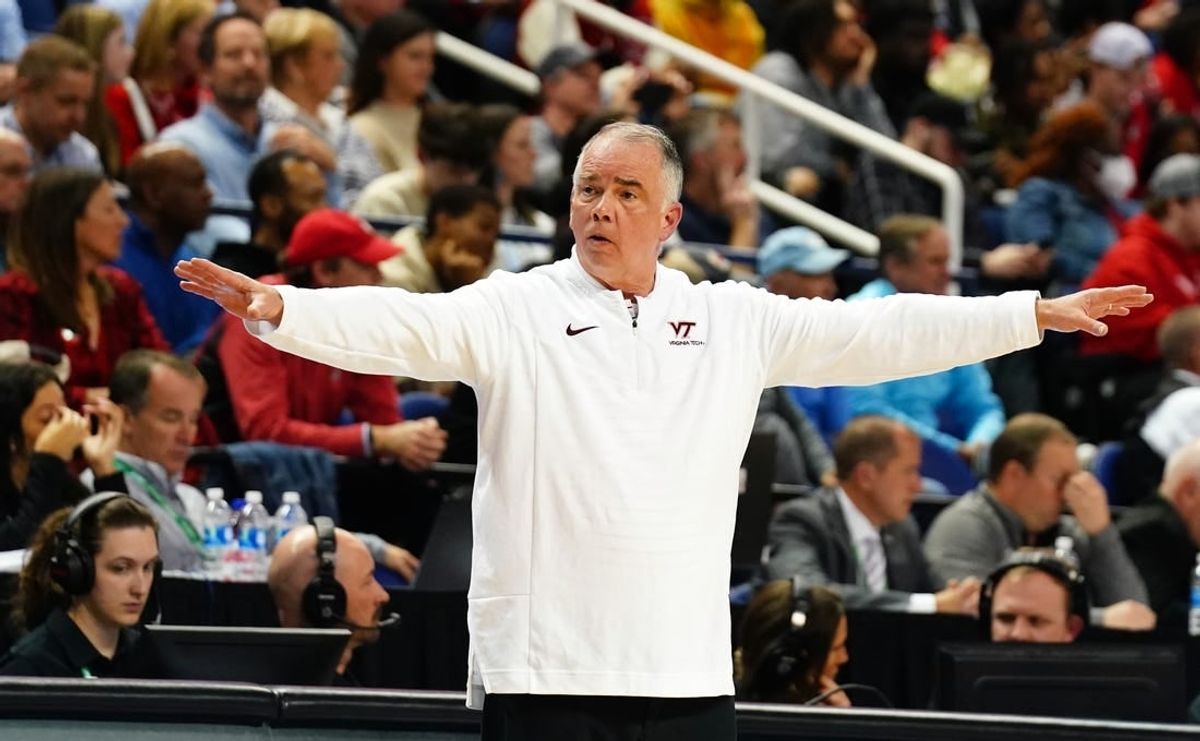 Mar 8, 2023; Greensboro, NC, USA; Virginia Tech Hokies head coach Mike Young signal to his players against the North Carolina State Wolfpack during the first half of the second round of the ACC tournament at Greensboro Coliseum.