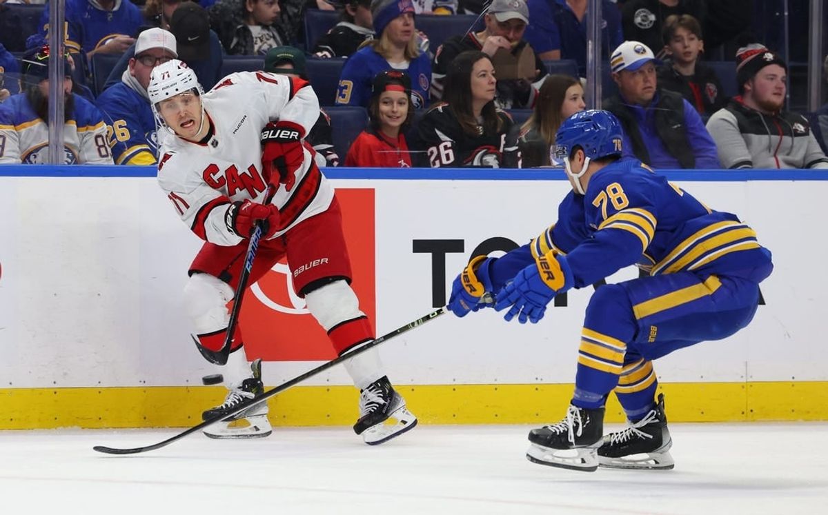 Feb 25, 2024; Buffalo, New York, USA;  Buffalo Sabres defenseman Jacob Bryson (78) tries to block a pass by Carolina Hurricanes right wing Jesper Fast (71) during the first period at KeyBank Center.