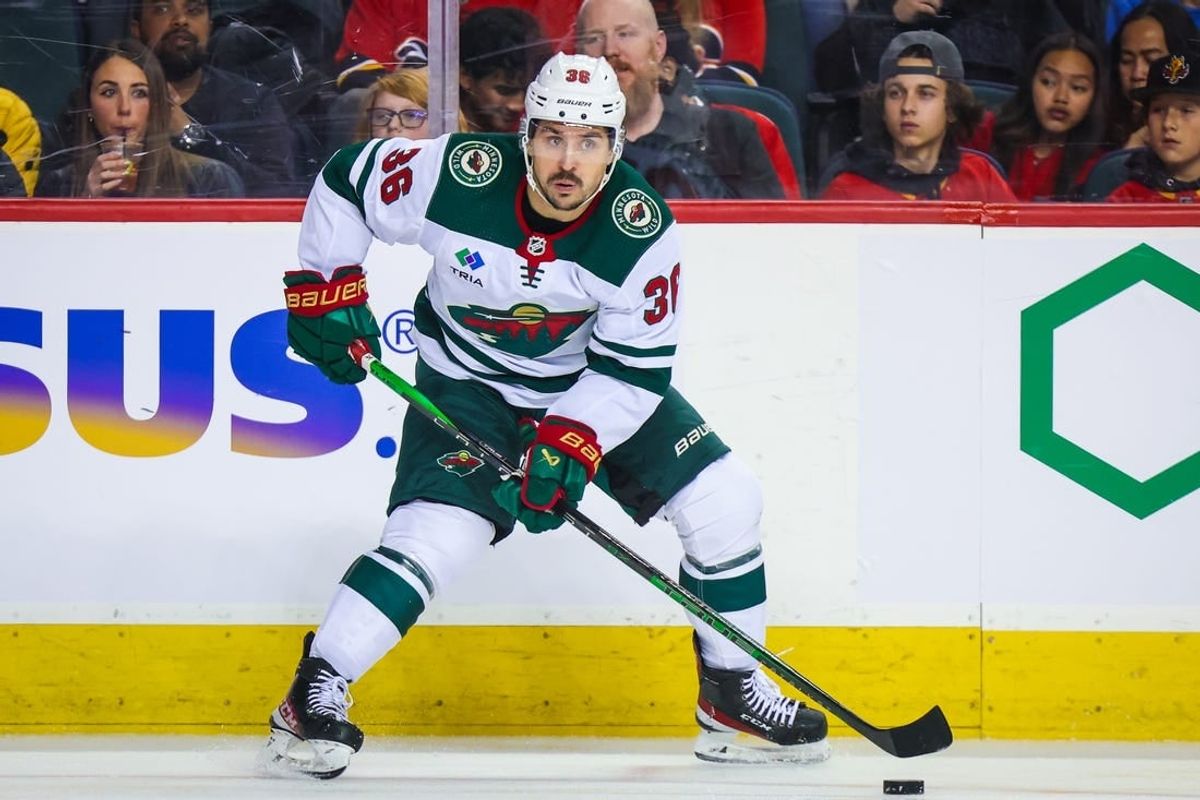 Dec 5, 2023; Calgary, Alberta, CAN; Minnesota Wild right wing Mats Zuccarello (36) controls the puck against the Calgary Flames during the first period at Scotiabank Saddledome.
