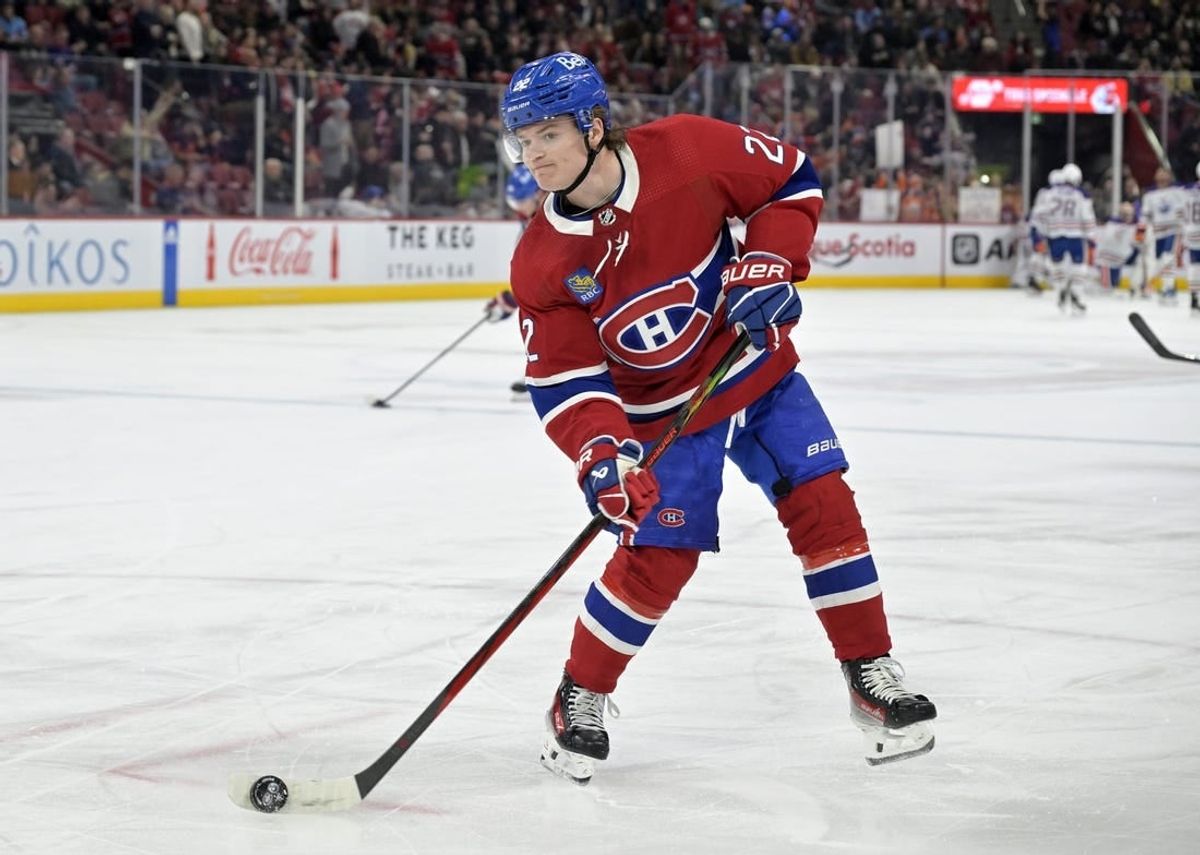 Jan 13, 2024; Montreal, Quebec, CAN; Montreal Canadiens forward Cole Caufield (22) shoots a puck during the warmup period before the game against the Edmonton Oilers at the Bell Centre.