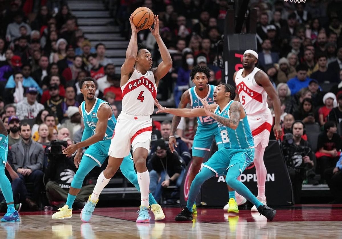 Dec 18, 2023; Toronto, Ontario, CAN; Toronto Raptors forward Scottie Barnes (4) controls the ball as Charlotte Hornets guard Nick Smith Jr. (8) tries to defend during the fourth quarter at Scotiabank Arena.