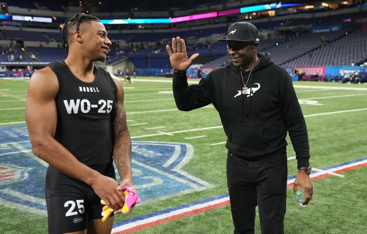 Southern California wide receiver Brenden Rice (WO25) and his father, NFL Hall of Fame player Jerry Rice during the 2024 NFL Combine at Lucas Oil Stadium.