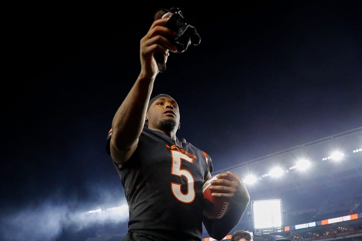 Nov 5, 2023; Cincinnati, Ohio, USA; Cincinnati Bengals wide receiver Tee Higgins (5) hands his gloves to fans after the victory over the Buffalo Bills at Paycor Stadium.