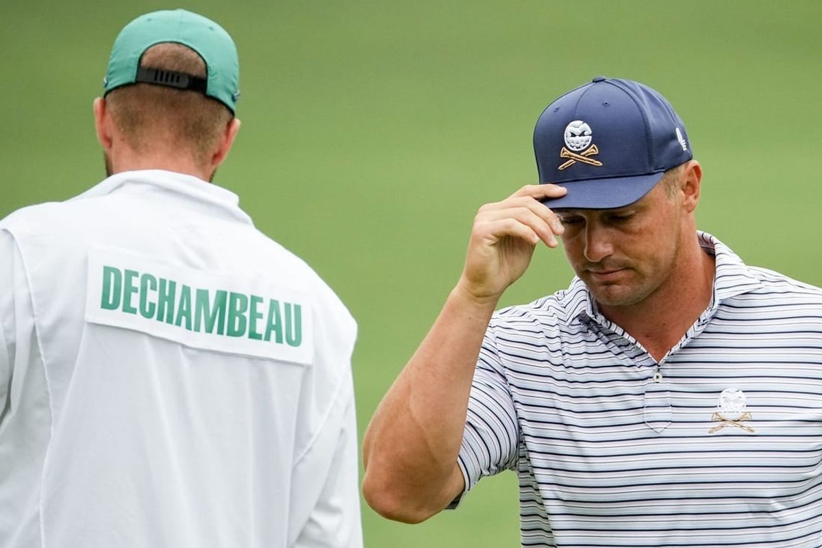 Apr 11, 2024; Augusta, Georgia, USA; Bryson DeChambeau tips his hat after putting on no. 2 during the first round of the Masters Tournament.