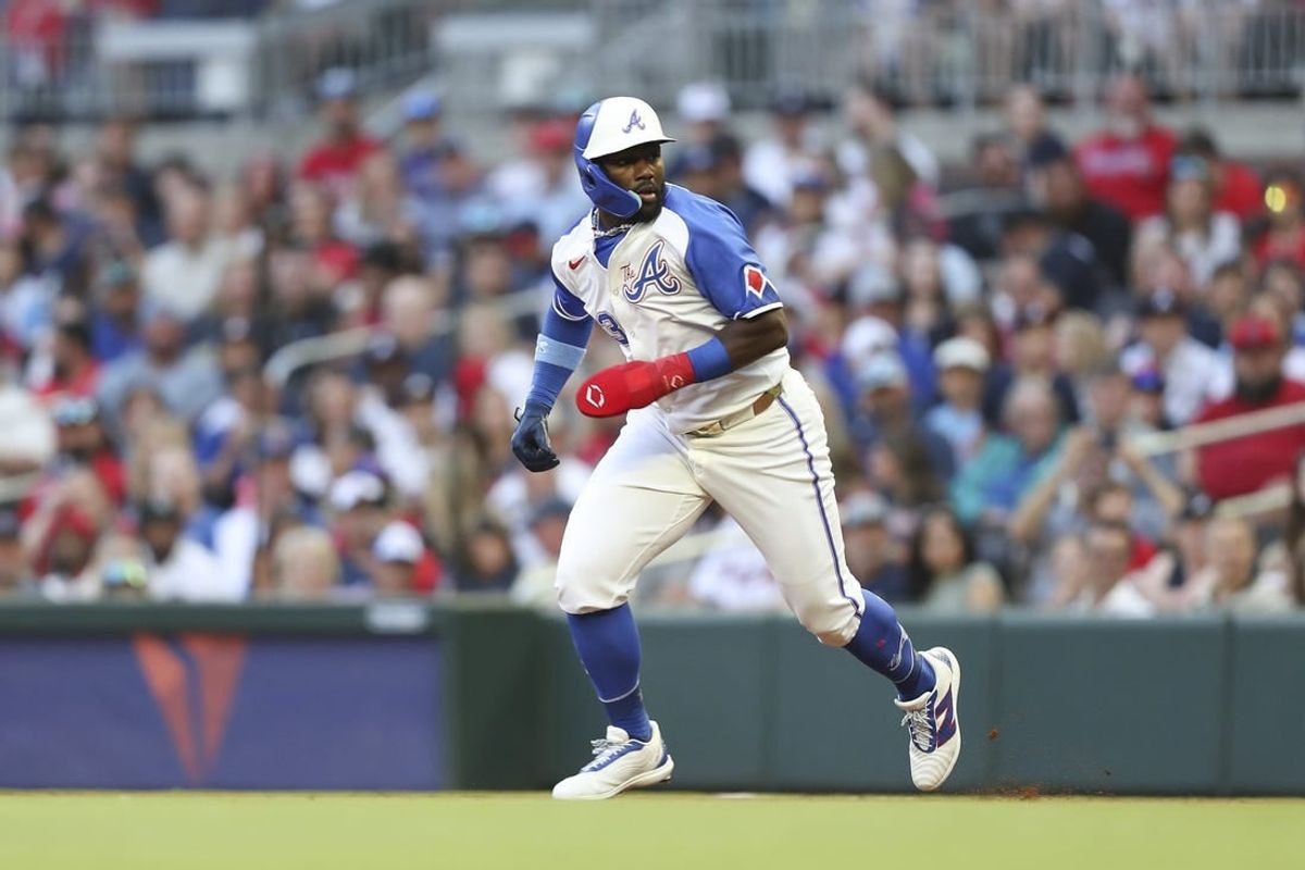 Apr 20, 2024; Cumberland, Georgia, USA; Atlanta Braves center fielder Michael Harris II (23) runs to second base in a game against the Texas Rangers in the first inning at Truist Park.