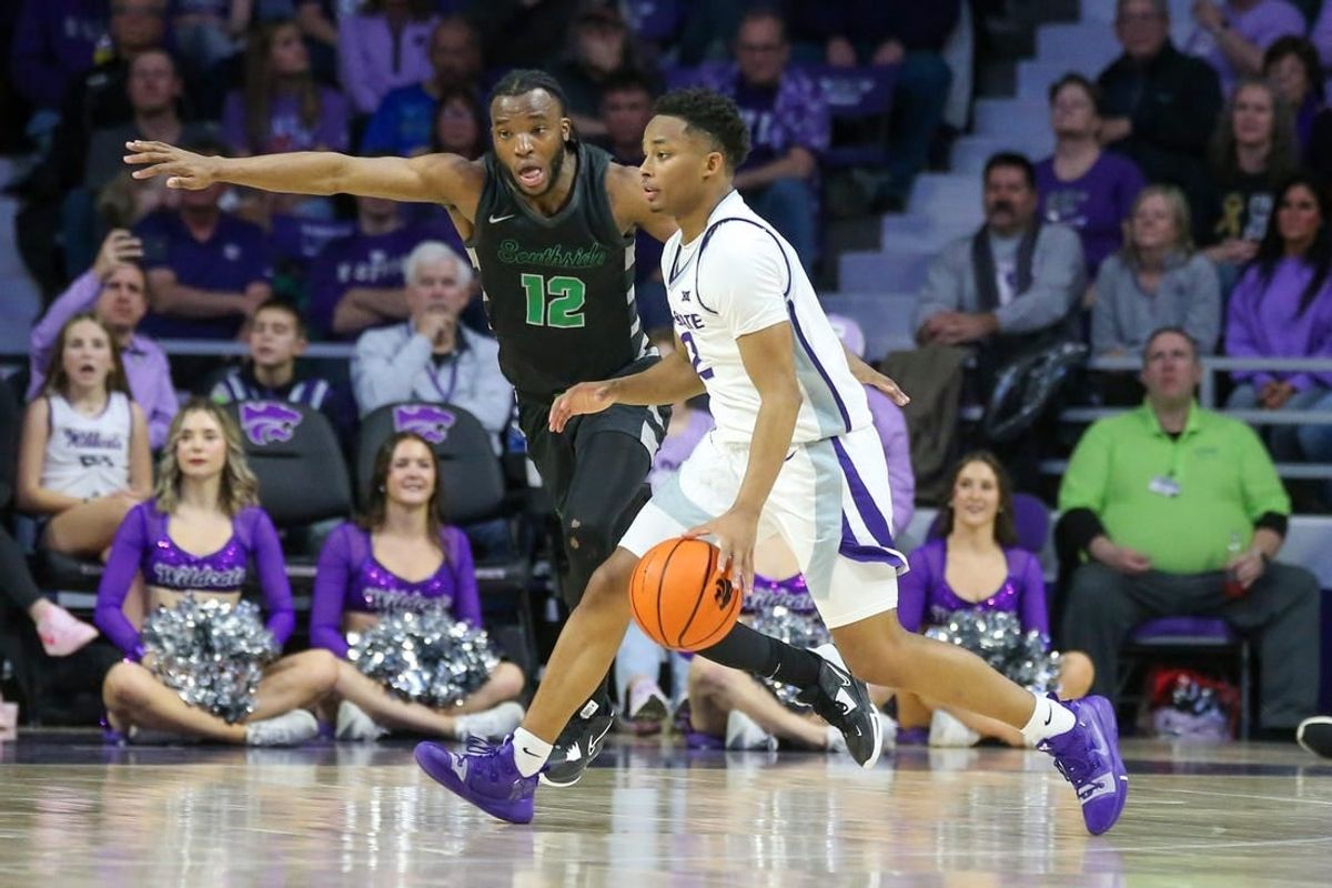 Jan 2, 2024; Manhattan, Kansas, USA; Kansas State Wildcats guard Tylor Perry (2) is guarded by Chicago State Cougars guard Brent Davis (12) during the second half at Bramlage Coliseum.