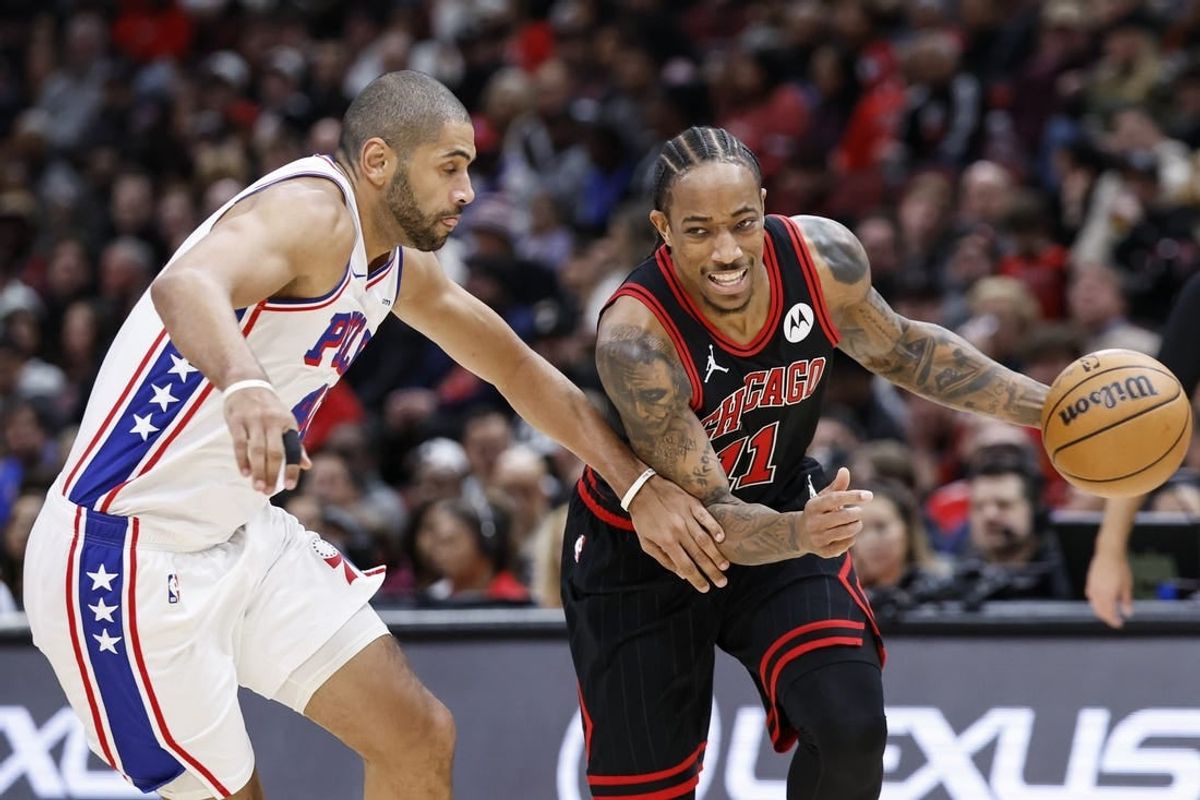 Dec 30, 2023; Chicago, Illinois, USA; Chicago Bulls forward DeMar DeRozan (11) drives to the basket against Philadelphia 76ers forward Nicolas Batum (40) during the first half at United Center.