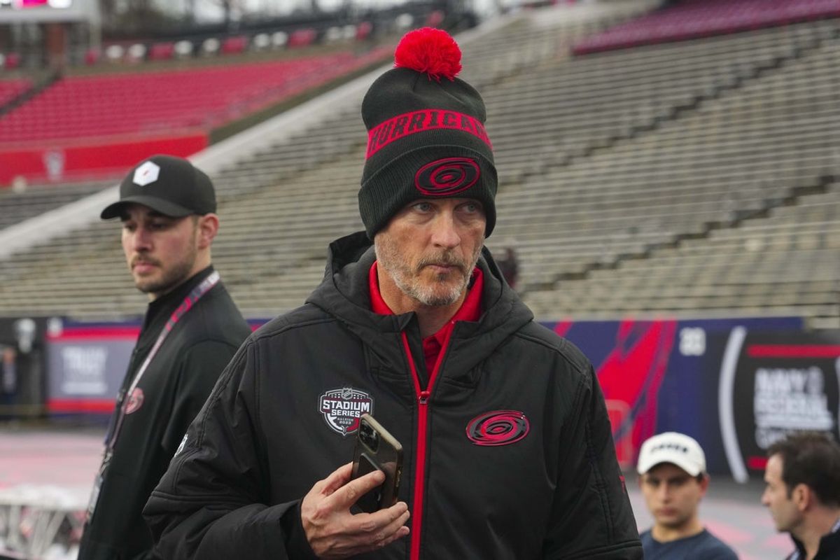 Feb 17, 2023; Raleigh, North Carolina, USA;  Carolina Hurricanes owner Tom Dundon looks on during practice at Carter-Finley Stadium. Mandatory Credit: James Guillory-Imagn Images
