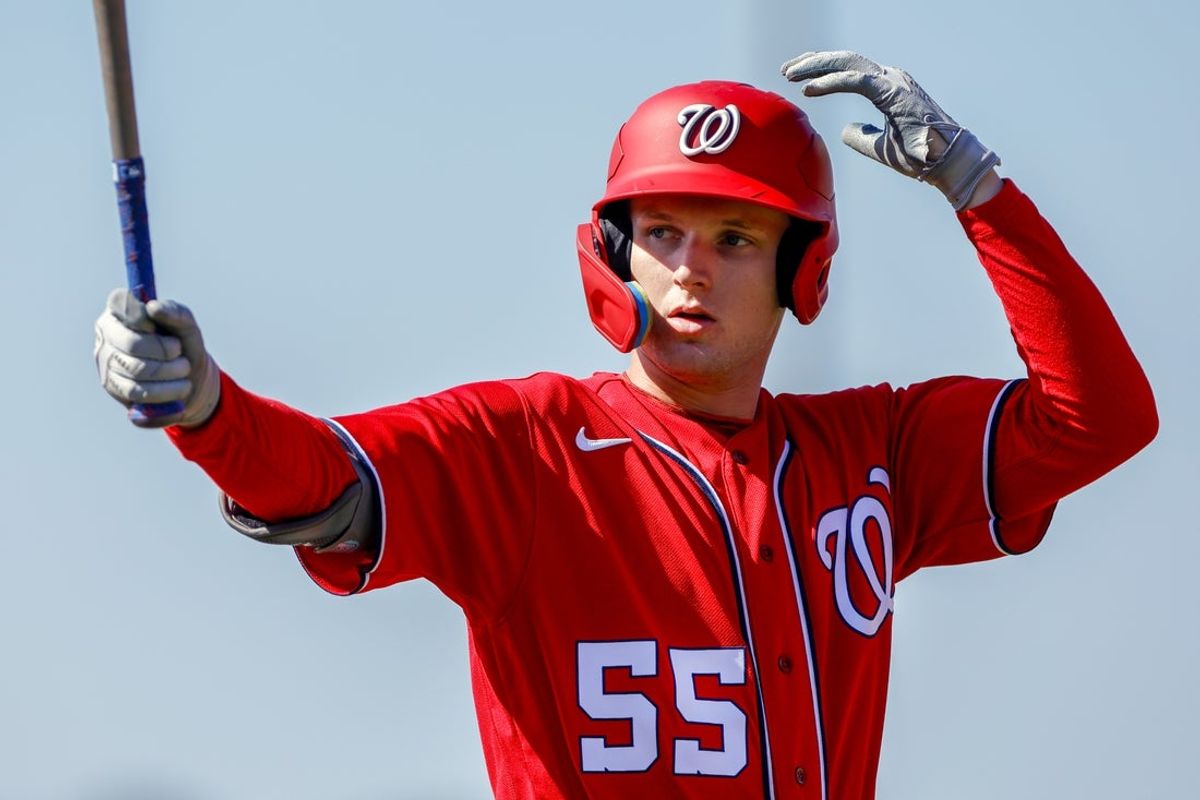 Feb 20, 2023; West Palm Beach, FL, USA; Washington Nationals outfielder Robert Hassell III (55) practices his swing during a spring training workout at The Ballpark of the Palm Beaches. Mandatory Credit: Sam Navarro-Imagn Images