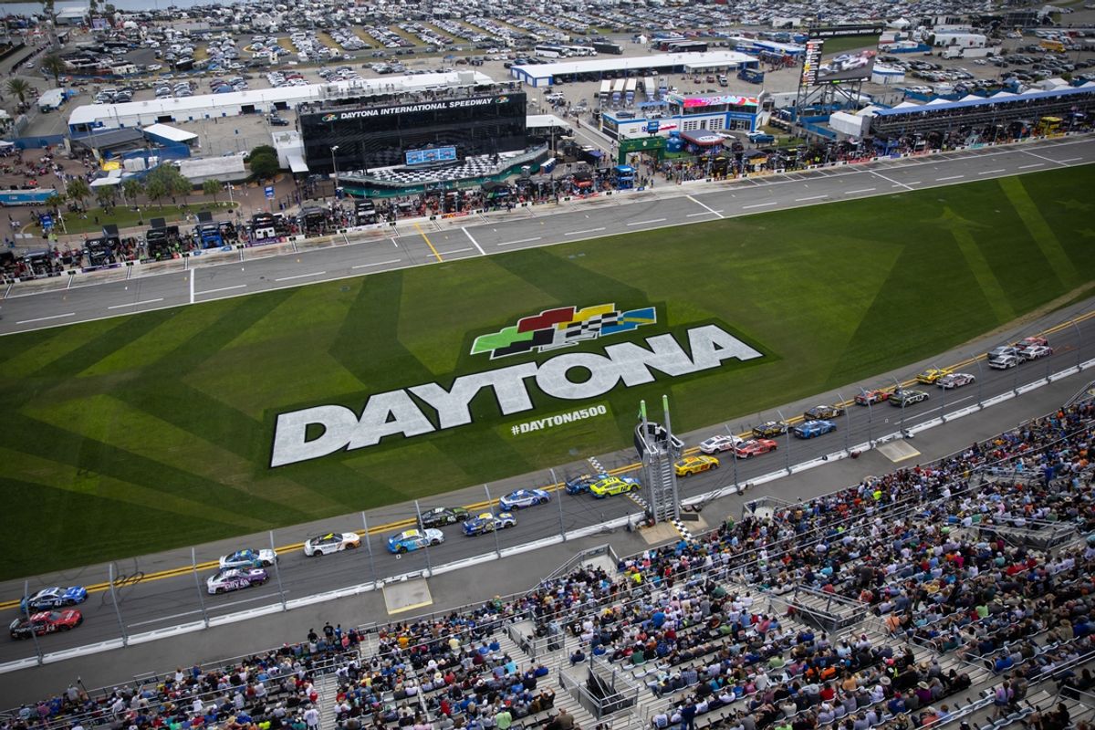 Feb 19, 2023; Daytona Beach, Florida, USA; A sold out crowd looks on as the field of NASCAR Cup Series drivers race past the start finish line and the front stretch grandstands during the Daytona 500 at Daytona International Speedway. Mandatory Credit: Mark J. Rebilas-Imagn Images