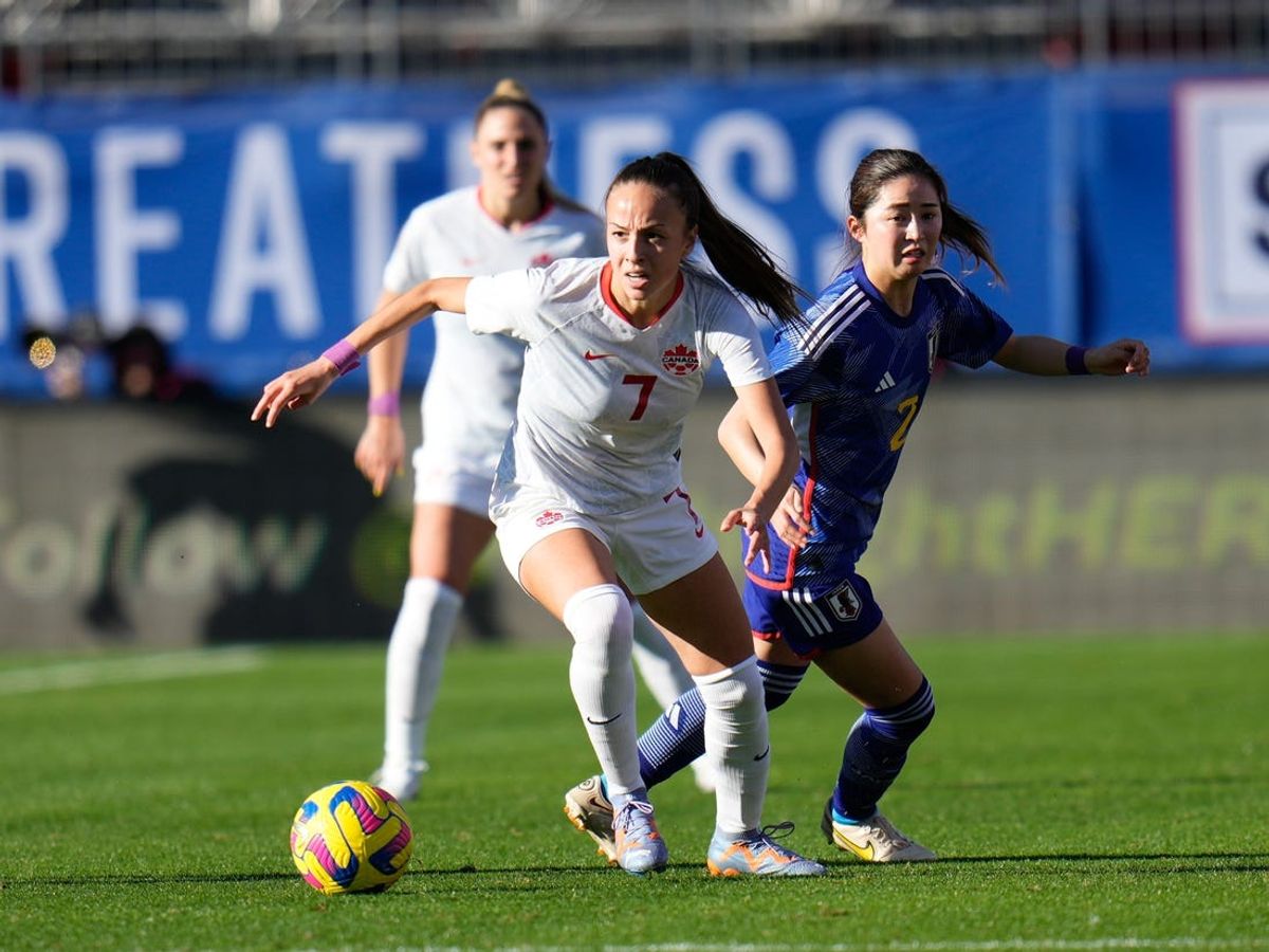 Feb 22, 2023; Frisco, Texas, USA; Canada midfielder Julia Grosso (7) moves the ball upfield against Japan defender Risa Shimizu (2) during the second half at Toyota Stadium. Mandatory Credit: Chris Jones-USA TODAY Sports