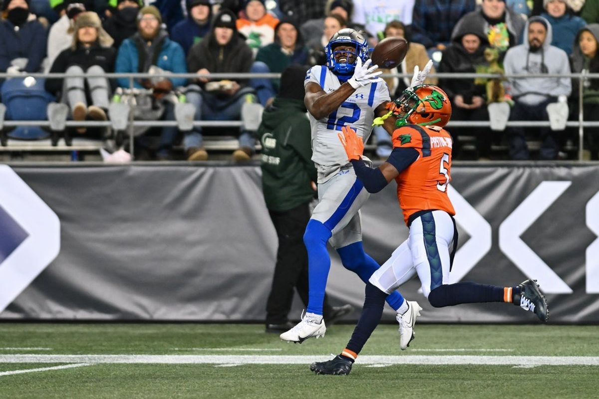 Feb 23, 2023; Seattle, WA, USA; Seattle Sea Dragons cornerback Chris Payton-Jones (5) breqks up a pass intended for St. Louis Battlehawks wide receiver Gary Jennings (12) during the second half at Lumen Field. St. Louis defeated Seattle 20-18. Mandatory Credit: Steven Bisig-Imagn Images