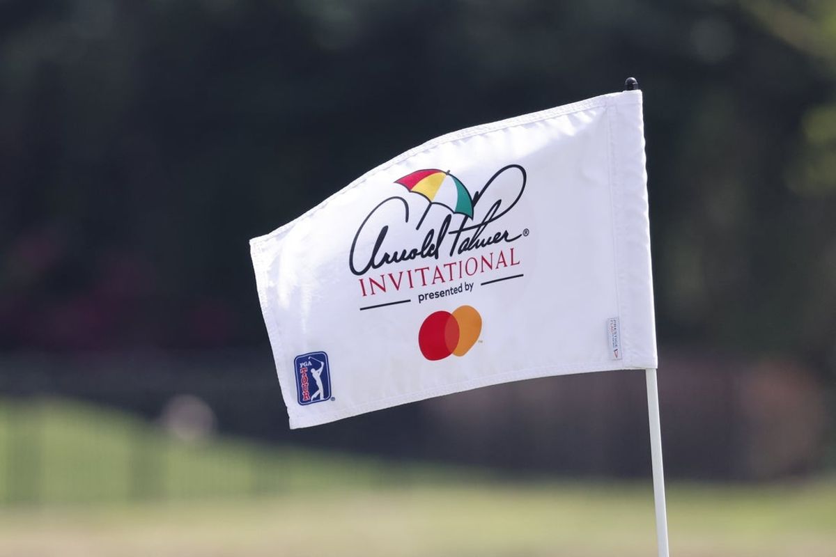 Mar 4, 2023; Orlando, Florida, USA; The Arnold Palmer Invitational flag sits atop the pole on the 18th green during the third round of the Arnold Palmer Invitational golf tournament. Mandatory Credit: Reinhold Matay-Imagn Images