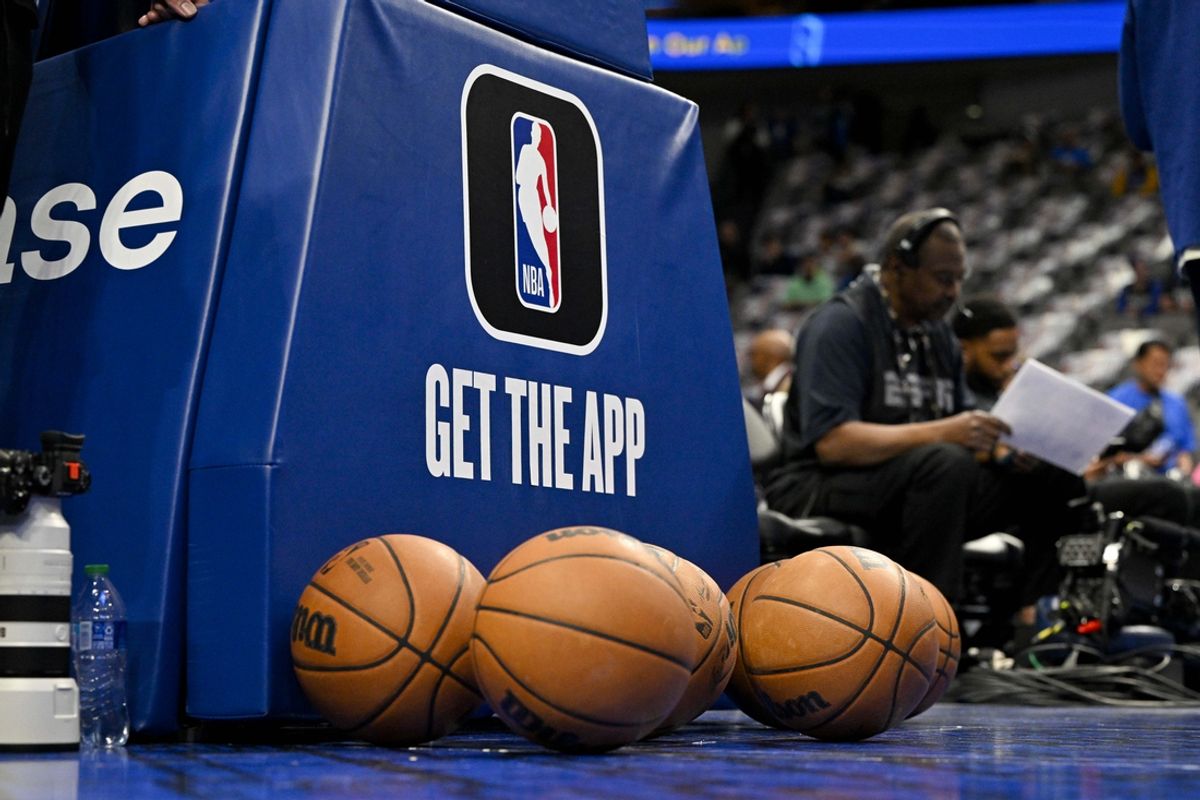 Mar 5, 2023; Dallas, Texas, USA; A view of the NBA logo and NBA app logo and basketballs in front of the base during warms up before the game between the Dallas Mavericks and the Suns at the American Airlines Center. Mandatory Credit: Jerome Miron-Imagn Images