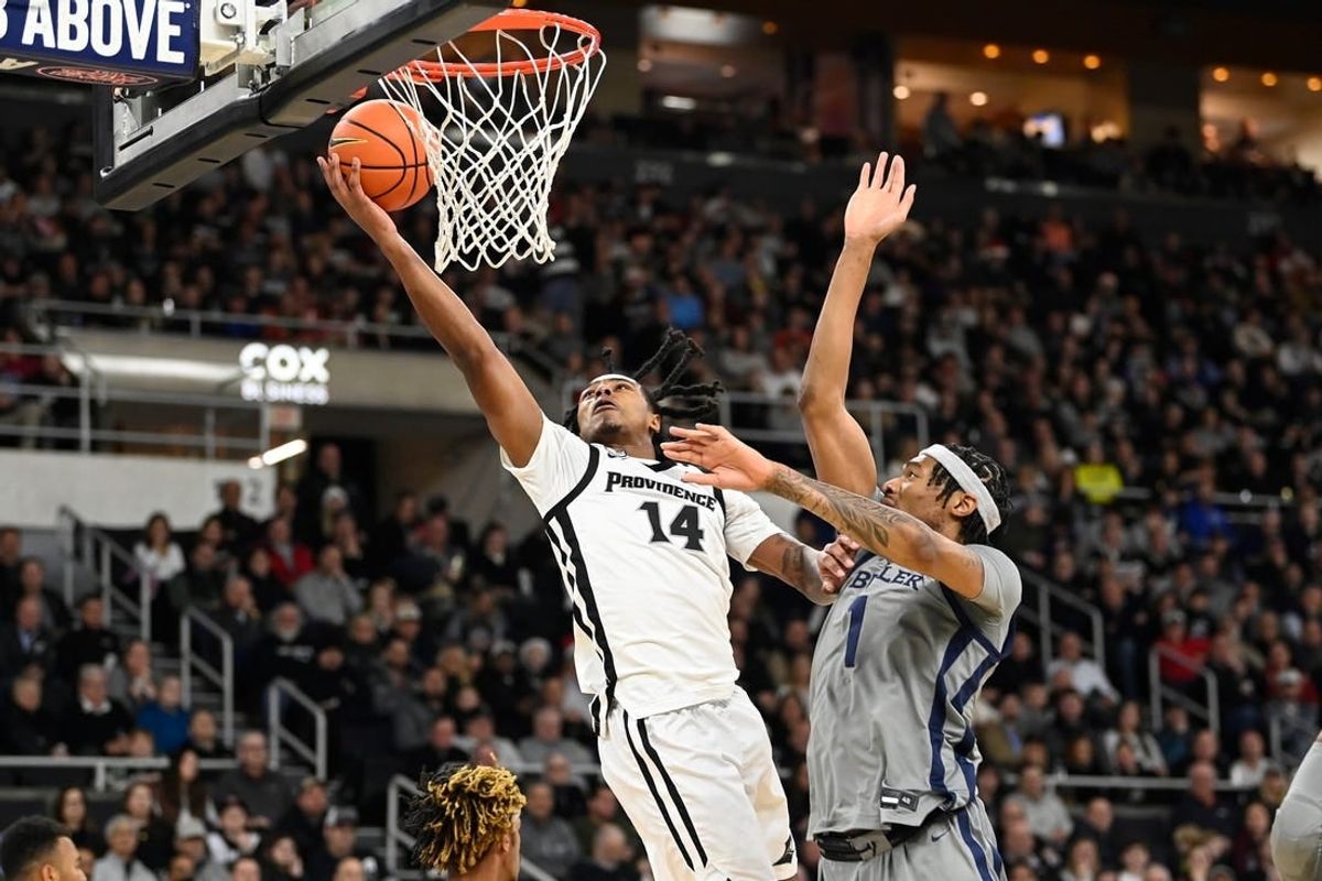 Dec 23, 2023; Providence, Rhode Island, USA; Providence Friars guard Corey Floyd Jr. (14) shoots the ball against the Butler Bulldogs during the first half at Amica Mutual Pavilion.