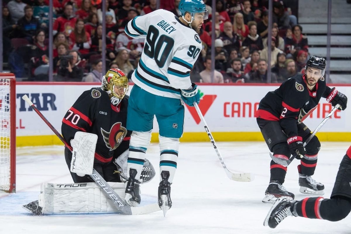 Jan 13, 2024; Ottawa, Ontario, CAN; San Jose Sharks right wing Justin Bailey (90) screens Ottawa Senators goalie Joonas Korpisalo (70) in the second period at the Canadian Tire Centre.