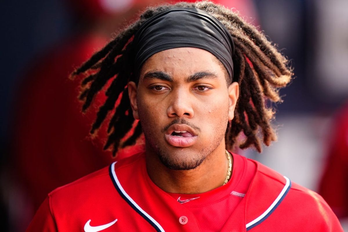 Mar 13, 2023; West Palm Beach, Florida, USA; Washington Nationals center fielder James Wood (97) walks in the dugout during a game against the Houston Astros at The Ballpark of the Palm Beaches. Mandatory Credit: Rich Storry-USA TODAY Sports