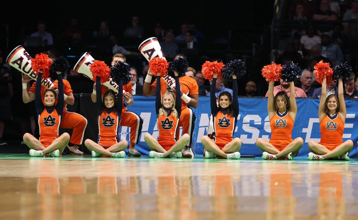 Mar 16, 2023; Birmingham, AL, USA;  Auburn Tigers cheerleaders perform against the Iowa Hawkeyes during the first half in the first round of the 2023 NCAA Tournament at Legacy Arena. Mandatory Credit: Vasha Hunt-Imagn Images