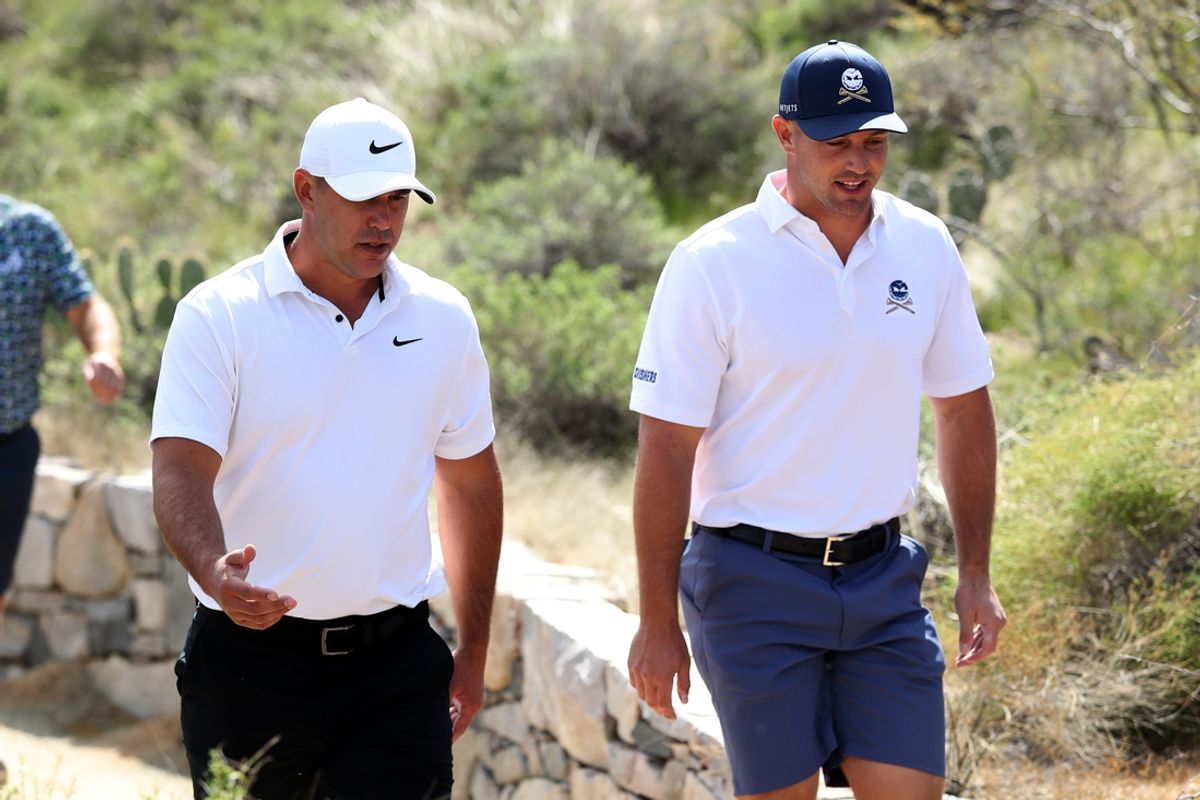 Mar 17, 2023; Tucson, Arizona, USA; Brooks Koepka and Bryson DeChambeau walk to the fairway of the 3rd hole during the first round of the LIV Golf event at The Gallery Golf Club. Mandatory Credit: Zachary BonDurant-Imagn Images