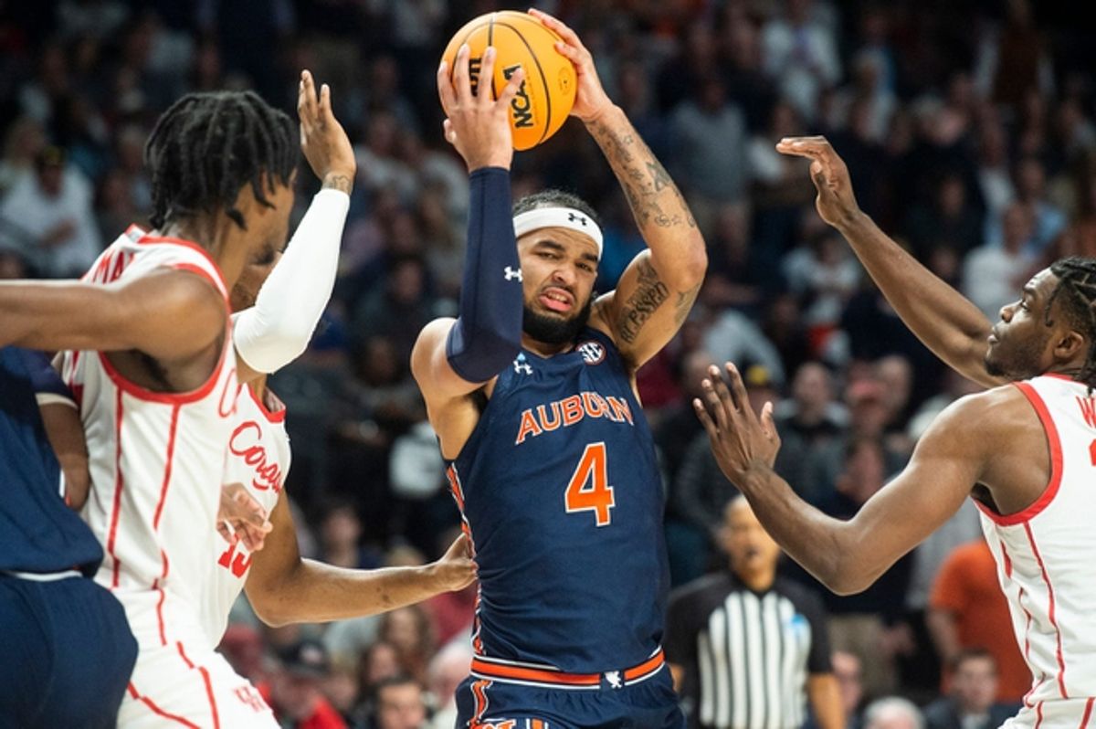 Auburn Tigers forward Johni Broome (4) makes a post move as Auburn Tigers take on Houston Cougars in the second round of NCAA Tournament at Legacy Arena in Birmingham, Ala., on Saturday, March 18, 2023. Auburn Tigers lead Houston Cougars  41-31 at halftime.