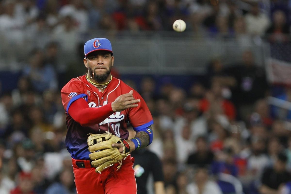 Mar 19, 2023; Miami, Florida, USA; Cuba third baseman Yoan Moncada (10) throws to first for an out during the third inning against the USA at LoanDepot Park. Mandatory Credit: Sam Navarro-Imagn Images