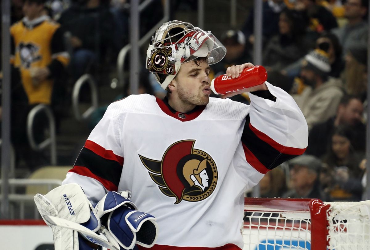 Mar 20, 2023; Pittsburgh, Pennsylvania, USA;  Ottawa Senators goaltender Dylan Ferguson (34) takes a drink during a time-out against the Pittsburgh Penguins  in the third period at PPG Paints Arena. Ottawa won 2-1. Mandatory Credit: Charles LeClaire-Imagn Images
