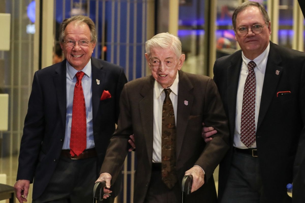 Mar 21, 2023; New York, NY, USA;  Former St. John   s head coach Lou Carnesecca (center) is escorted into the introductory press conference for new head coach Rick Pitino at Madison Square Garden. Mandatory Credit: Wendell Cruz-Imagn Images