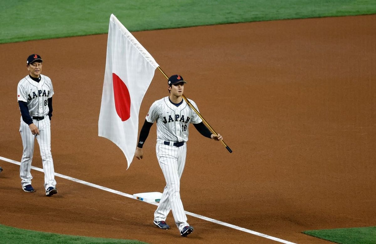 Mar 21, 2023; Miami, Florida, USA; Japan designated hitter Shohei Ohtani (16) and manager Hideki Kuriyama (89) enter the ballpark for team introductions against the USA at LoanDepot Park. Mandatory Credit: Rhona Wise-Imagn Images