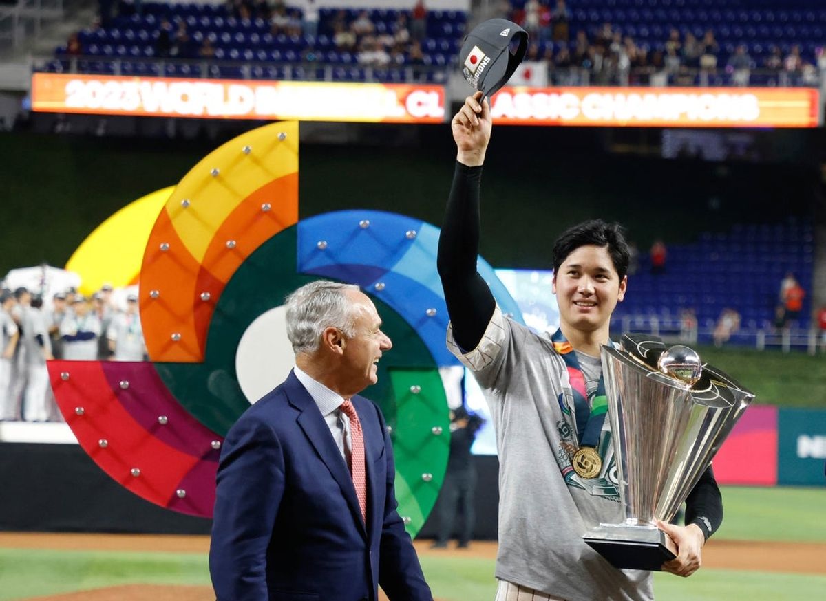 Mar 21, 2023; Miami, Florida, USA; Japan designated hitter and closing pitcher Shohei Ohtani (16) stands with the World Baseball Classic trophy after defeating the USA in the World Baseball Classic at LoanDepot Park. Mandatory Credit: Rhona Wise-Imagn Images