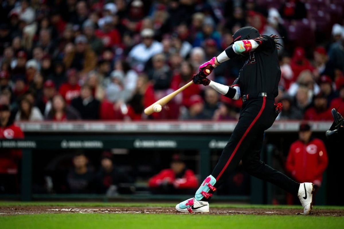 Cincinnati Reds shortstop Elly De La Cruz (44) hits a double in the fourth inning of the MLB baseball game between the Cincinnati Reds and New York Mets at Great American Ball Park in Cincinnati on Friday, April 5, 2024.