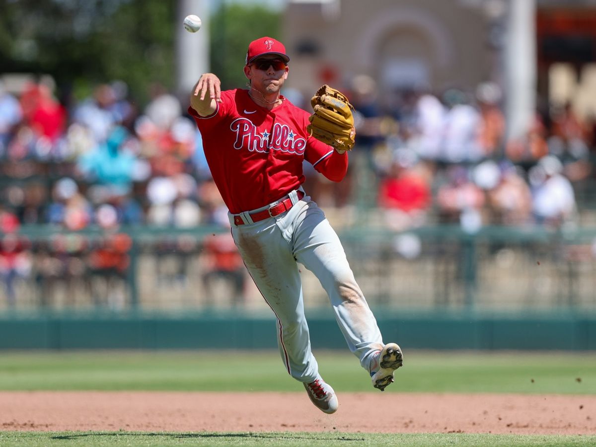 Mar 26, 2023; Sarasota, Florida, USA;  Philadelphia Phillies shortstop Scott Kingery (4) throws to first against the Baltimore Orioles in the fourth inning during spring training at Ed Smith Stadium. Mandatory Credit: Nathan Ray Seebeck-Imagn Images