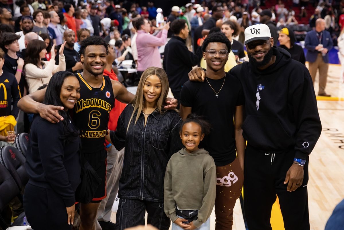 Mar 28, 2023; Houston, TX, USA; West guard Bronny James (6) poses for a family photo with grandmother Gloria Marie James, mother  Savannah James , brother Bryce Maximus James, sister Zhuri Nova James and father LeBron James following the McDonald's All American Boy's high school basketball game at Toyota Center. Mandatory Credit: Mark J. Rebilas-Imagn Images
