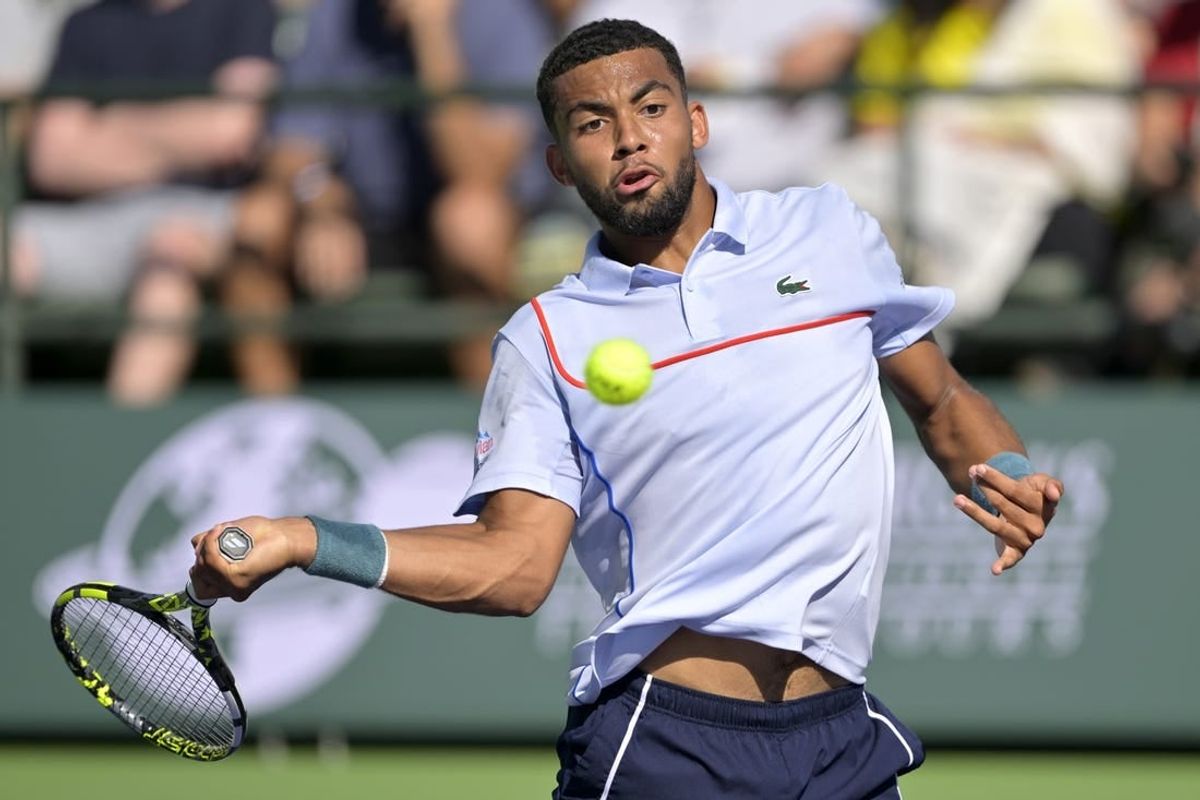 Mar 11, 2024; Indian Wells, CA, USA; Arthur Fils (FRA) hits a shot in his third round match against Casper Ruud (NOR) in the BNP Paribas Open at the Indian Wells Tennis Garden.