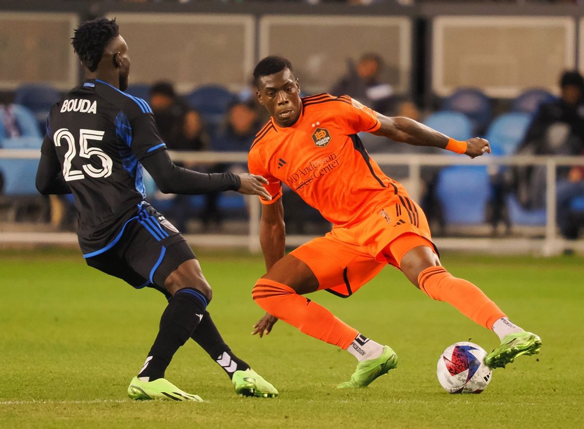 Apr 1, 2023; San Jose, California, USA; Houston Dynamo defender Teenage Hadebe (17) extends for the ball against San Jose Earthquakes forward Ousseni Bouda (25) during the second half at PayPal Park. Mandatory Credit: Kelley L Cox-USA TODAY Sports