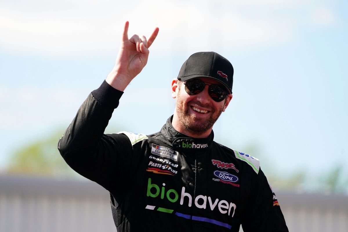 Apr 2, 2023; Richmond, Virginia, USA; Cody Ware waves to fans before the race during the Toyota Owners 400 at Richmond Raceway. Mandatory Credit: John David Mercer-Imagn Images