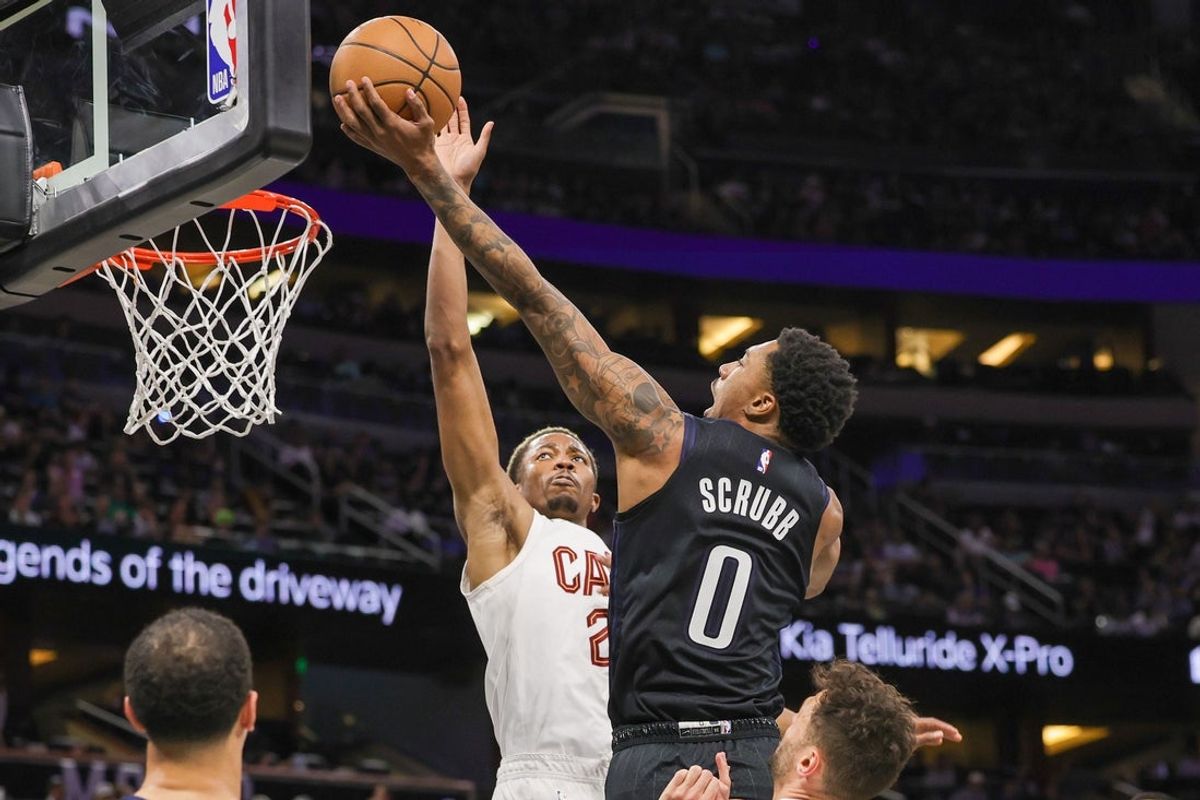Apr 6, 2023; Orlando, Florida, USA; Orlando Magic guard Jay Scrubb (0) goes to the basket against Cleveland Cavaliers forward Mamadi Diakite (21) during the second half at Amway Center. Mandatory Credit: Mike Watters-Imagn Images