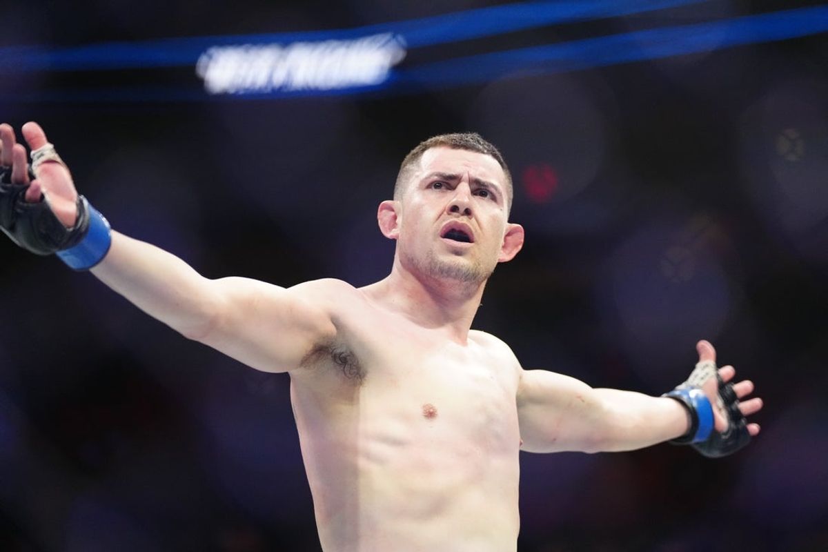Apr 8, 2023; Miami, Florida, USA; Steve Garcia (blue gloves) reacts after defeating Shayilan Nuerdanbieke (red gloves) during UFC 287 at Miami-Dade Arena. Mandatory Credit: Rich Storry-Imagn Images