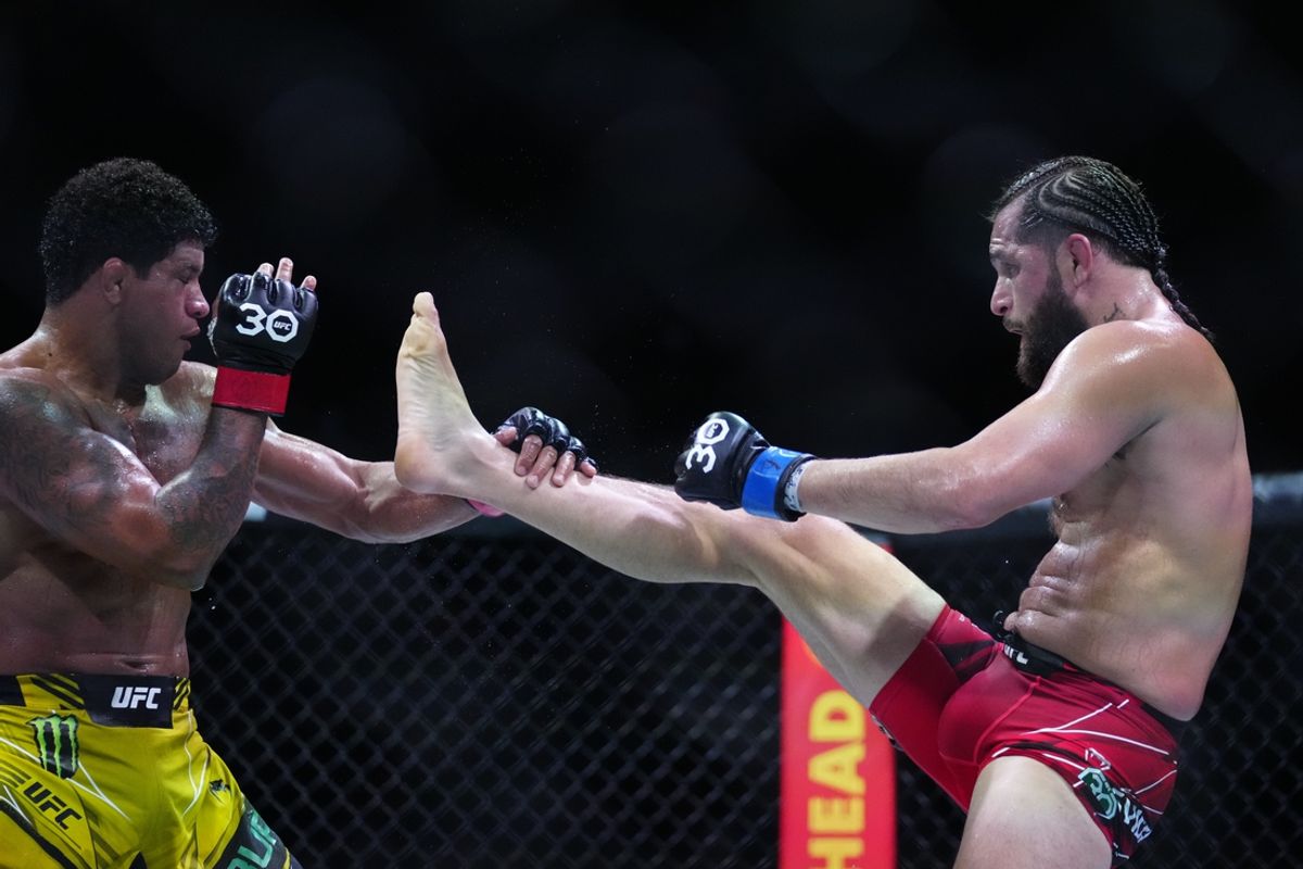 Apr 8, 2023; Miami, Florida, USA; Gilbert Burns (red gloves) fights Jorge Masvidal (blue gloves) during UFC 287 at Miami-Dade Arena. Mandatory Credit: Rich Storry-Imagn Images