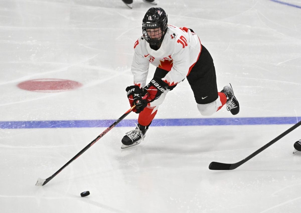 Apr 15, 2023; Brampton, Ontario, CAN;   Canada forward Sarah Fillier (10) pursues the puck against Switzerland in the third period at CAA Center. Mandatory Credit: Dan Hamilton-Imagn Images