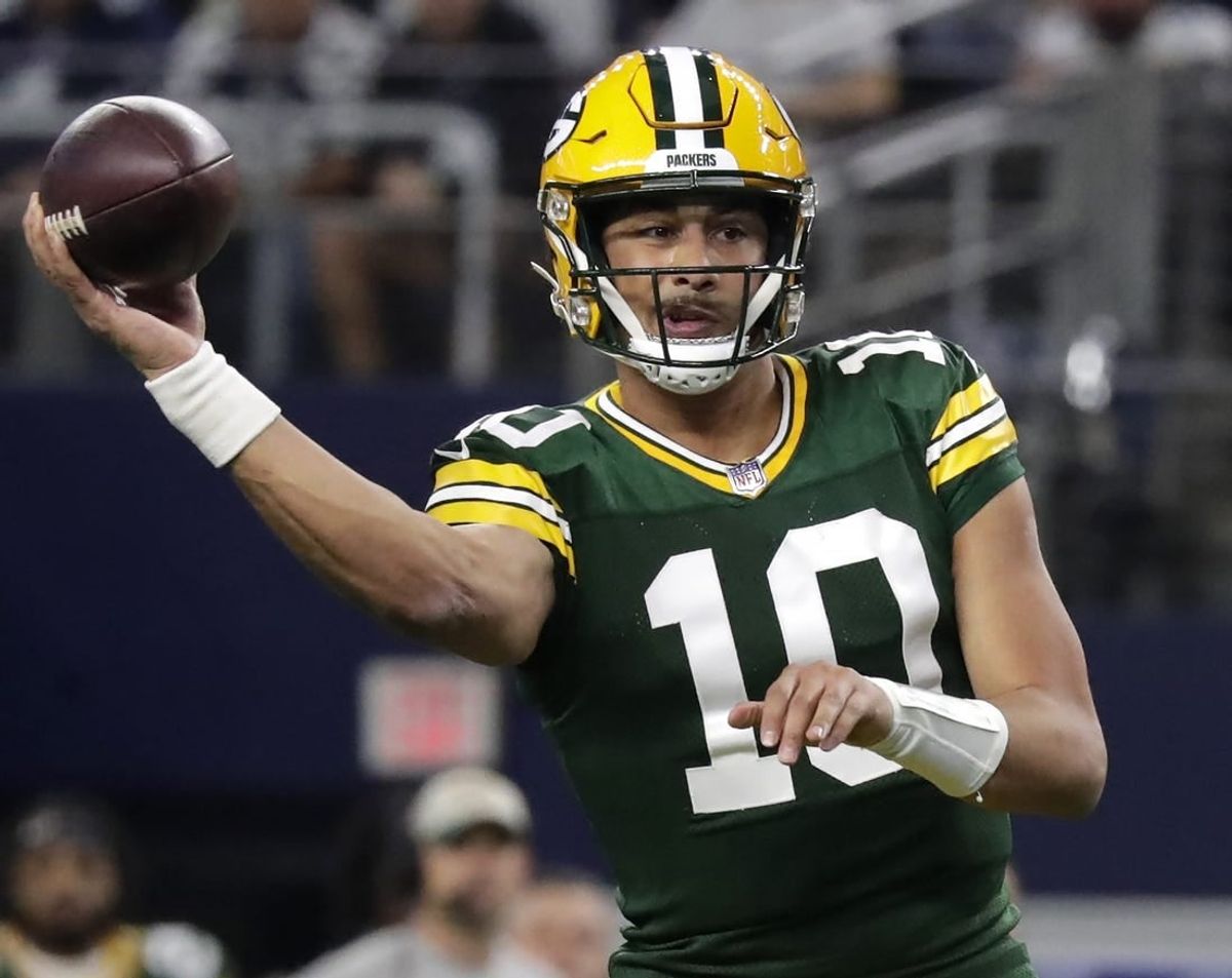 Jan 14, 2024; Arlington, Texas, USA; Green Bay Packers quarterback Jordan Love (10) throws against the Dallas cowboys during the second quarter in a 2024 NFC wild card game at AT&T Stadium.