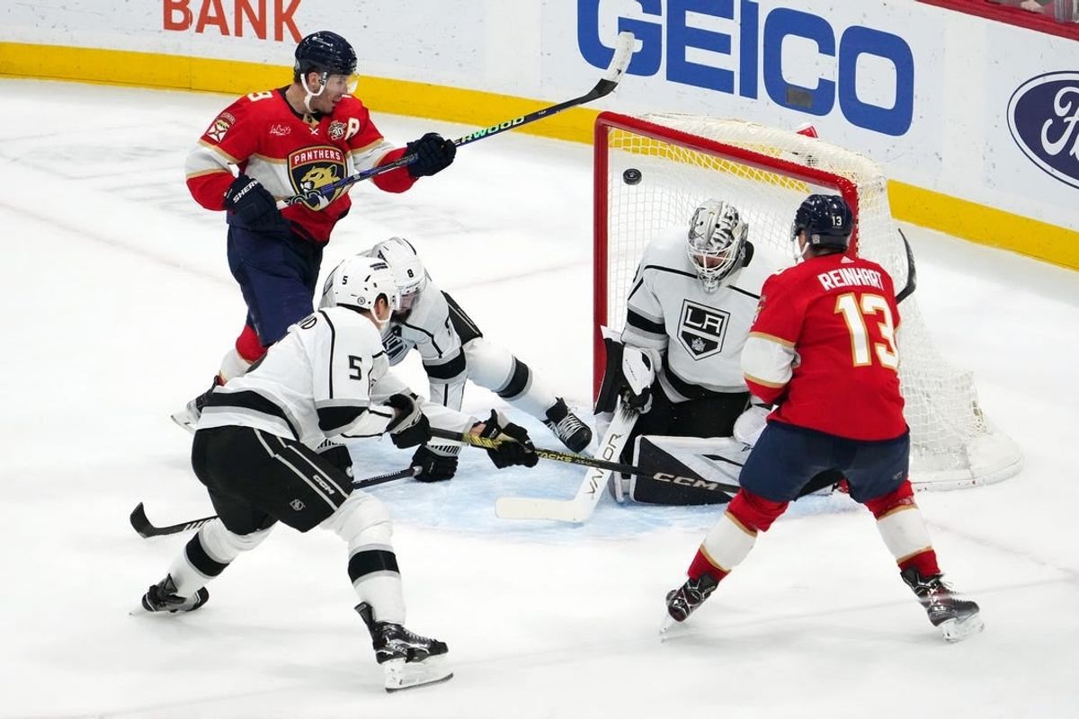Jan 11, 2024; Sunrise, Florida, USA; Florida Panthers center Sam Reinhart (13) scores the game winning goal past Los Angeles Kings goaltender Cam Talbot (39) with 00.7 seconds left in the overtime period at Amerant Bank Arena.