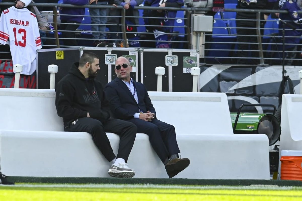 Dec 31, 2023; Baltimore, Maryland, USA; Baltimore Ravens general manager Eric DeCosta speaks with tight end Mark Andrews on the sidelines before the game against the Miami Dolphins  at M&T Bank Stadium.