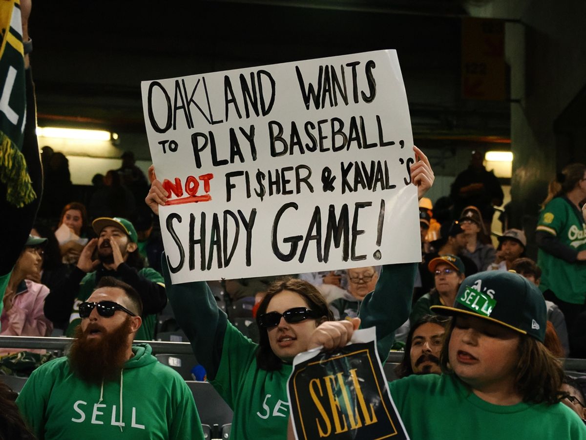 Apr 28, 2023; Oakland, California, USA; An Oakland Athletics fan holds a sign in reference to owner John Fisher and president Dave Kaval (not pictured) during the sixth inning against the Cincinnati Reds at Oakland Coliseum. Mandatory Credit: Kelley L Cox-Imagn Images
