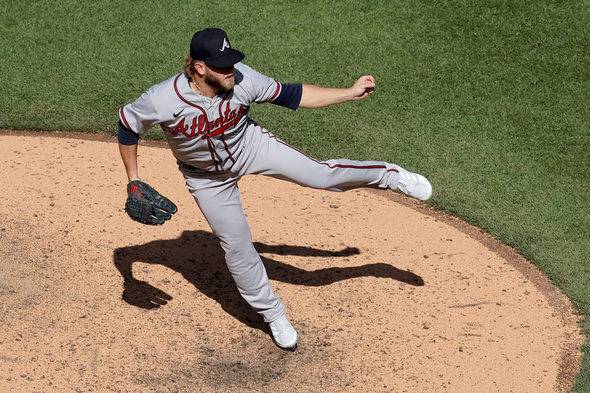 May 1, 2023; New York City, New York, USA; Atlanta Braves relief pitcher A.J. Minter (33) follows through on a pitch against the New York Mets during the ninth inning at Citi Field. Mandatory Credit: Brad Penner-Imagn Images