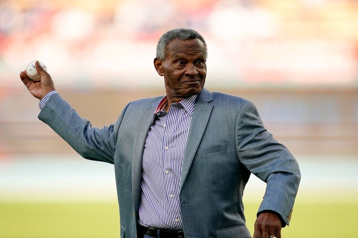 Apr 29, 2023; Los Angeles, California, USA; Los Angeles Dodgers broadcaster and former player Manny Mota throws the pitch prior to the start of a game between the St. Louis Cardinals and Los Angeles Dodgers at Dodger Stadium. Mandatory Credit: Lucas Peltier-Imagn Images