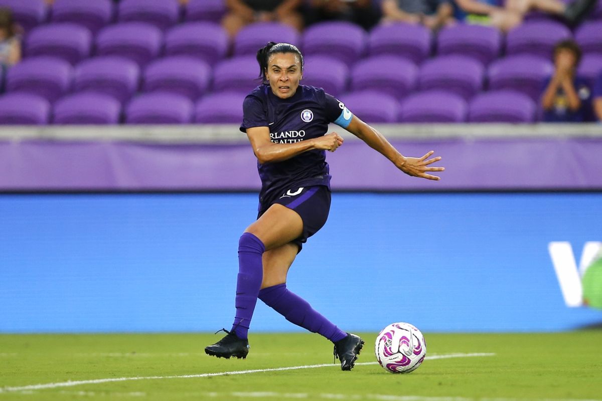May 6, 2023; Orlando, Florida, USA; Orlando Pride forward Marta (10) shoots the ball against Racing Louisville FC during the first half at Exploria Stadium. Mandatory Credit: Russell Lansford-Imagn Images