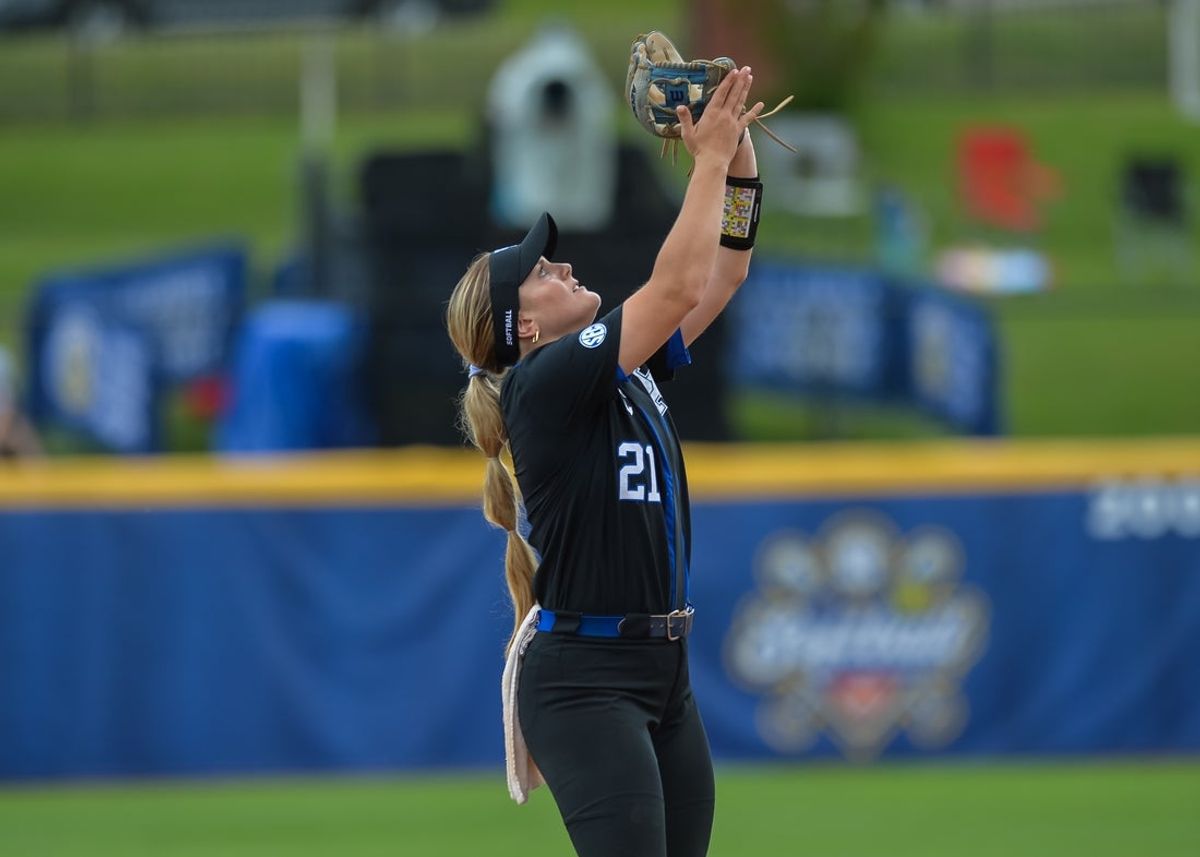 May 11, 2023; Fayetteville, AK, USA;  Kentucky Wildcats infielder Erin Coffel (21) makes a catch during the rain delayed first round game against the Florida Gators in the SEC Softball Tournament. Mandatory Credit: Brett Rojo-Imagn ImagesMandatory Credit: Brett Rojo-Imagn Images