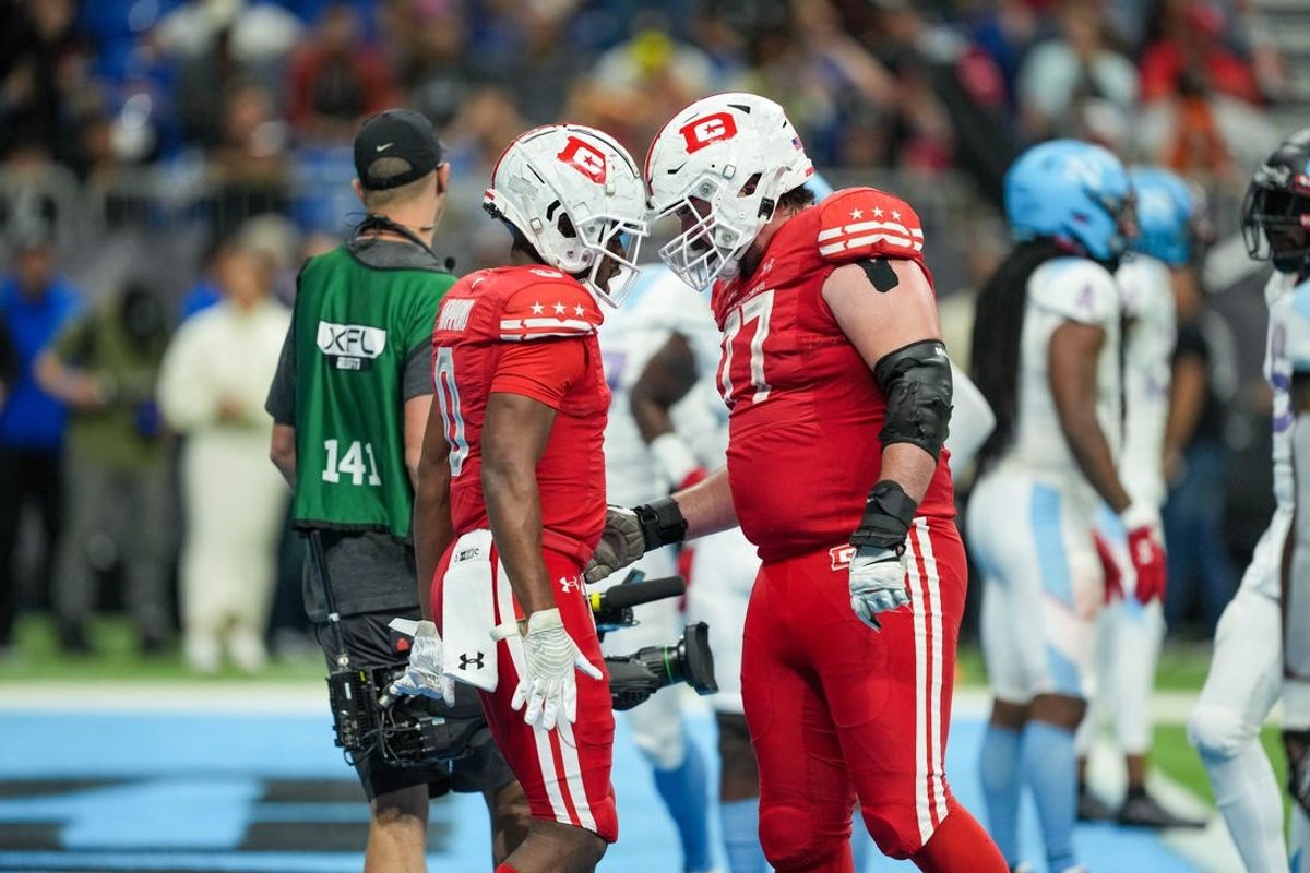 May 13, 2023; San Antonio, TX, USA;  DC Defenders wide receiver Josh Hammond (0) celebrates his touchdown with offensive lineman Liam Fornadel (77) in the second half at the Alamodome. Mandatory Credit: Daniel Dunn-USA TODAY Sports